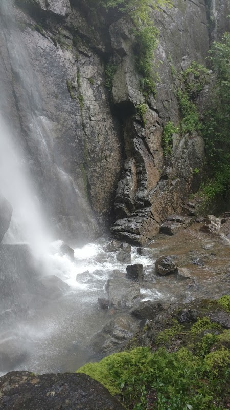 Hike to Rainbow Falls: A Stunning Cascading Wonder   surrounding landscape