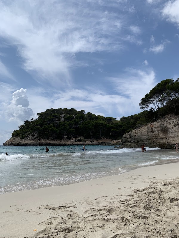 Azure Waters and Limestone Cliffs at Cala Mitjana - Cala Mitjana