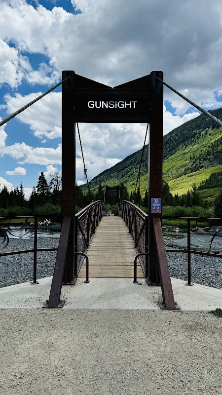 Discovering the Natural Beauty of Gunsight Pass Trail surrounding landscape