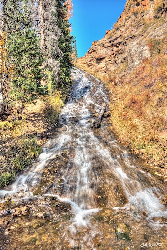 Captivating Cascades of Rex Falls surrounding landscape