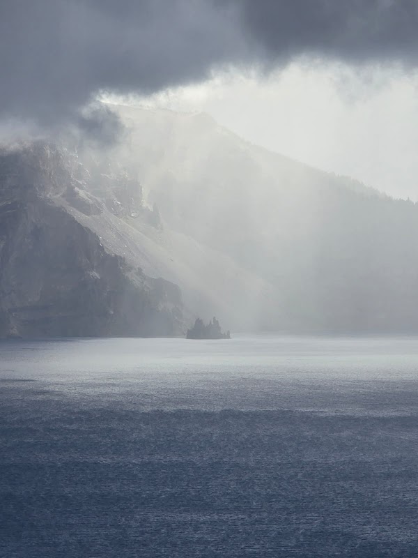 Mysterious Majesty: Phantom Ship in Crater Lake surrounding landscape