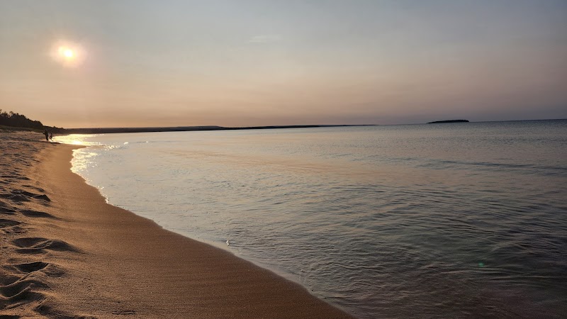 Scenic Shoreline and River Confluence at AuTrain Beach surrounding landscape